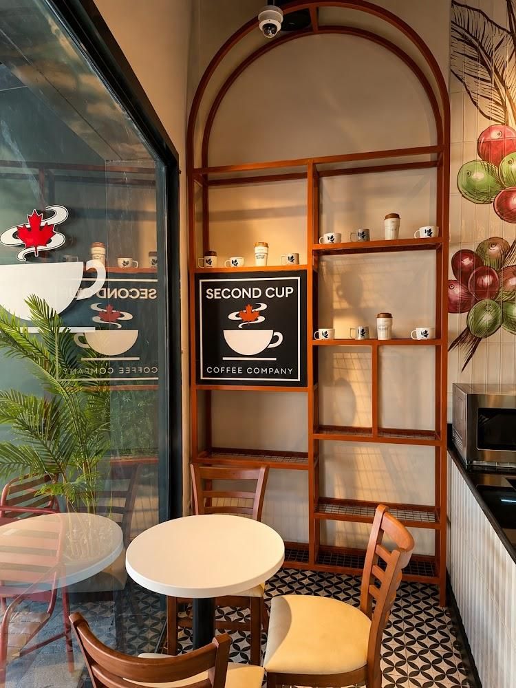 Café corner with Second Cup mugs on display